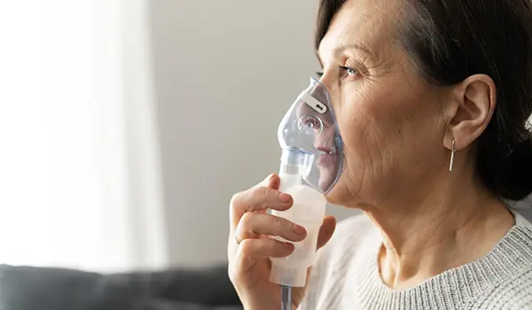 woman with oxygen mask